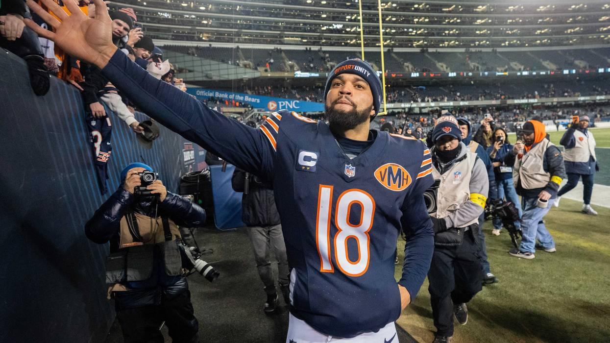 Bears quarterback Caleb Williams (18) high fives fans after their game Saturday, December 20, 2025 at Soldier Field