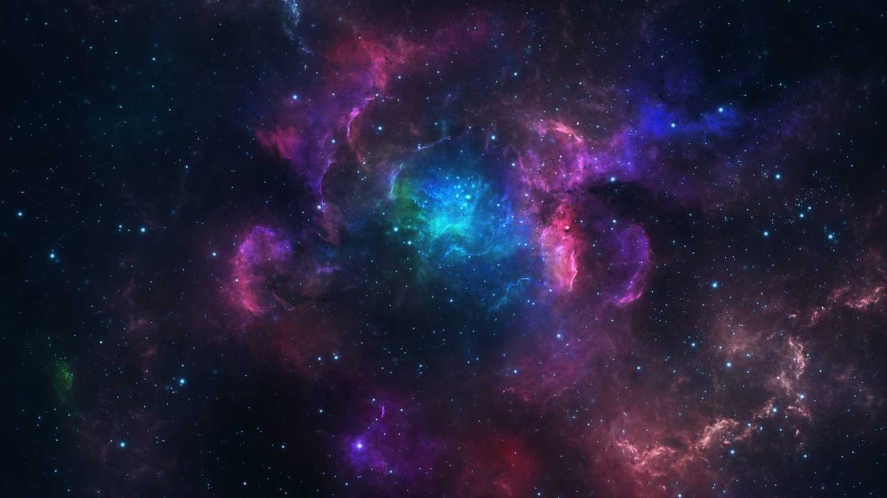 Beautiful blue and pink nebula with stars.