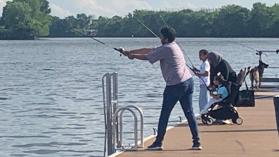 Beginner anglers cast their lines