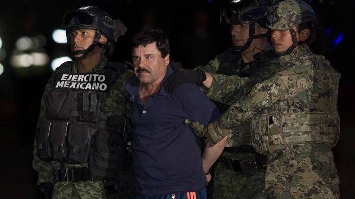 BEIJING, Jan. 10, 2016 (Xinhua) -- Soldiers escort Joaquin Guzman Loera, alias "El Chapo", upon his arrival to the hangar of the Attorney General's Office, in Mexico City, capital of Mexico, on Jan. 8, 2016. After an early morning raid in northwestern Mex