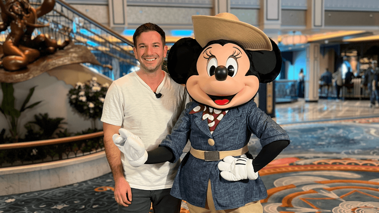 Bennett chats with Joe and Captain Minnie on the Grand Hall of the Disney Treasure