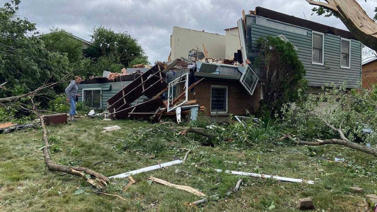 Beverly Sedleseck surveys the devastation of her boyfriend’s home in Woodridge. He’s in an assisted living facility and was not in the home when it was destroyed by Sunday night’s tornado.