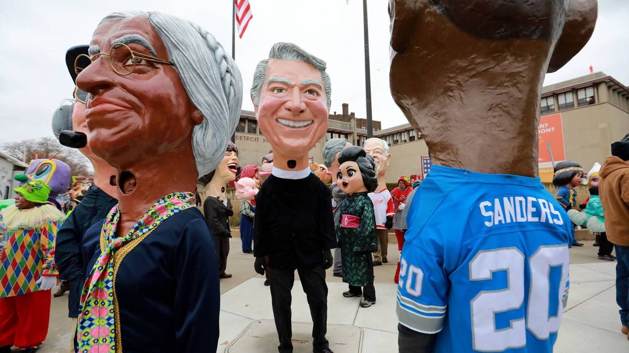 Big Heads made out of papier-mache stand outside of the Detroit Historical Museum waiting to join America's Thanksgiving Parade in Detroit