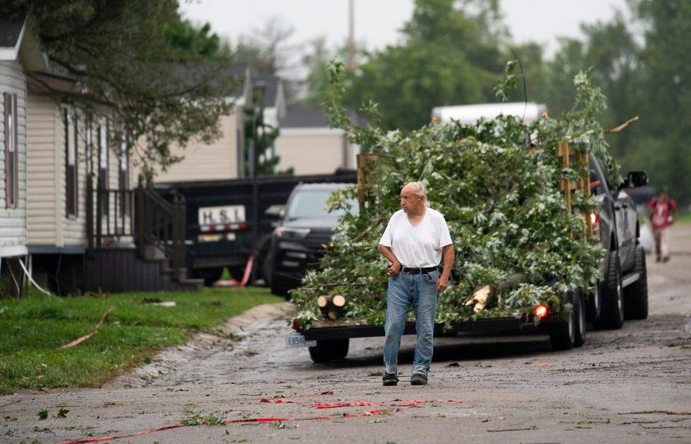 Bill Horvath walks around his Frenchtown Villas Monroe neighborhood to assess damage