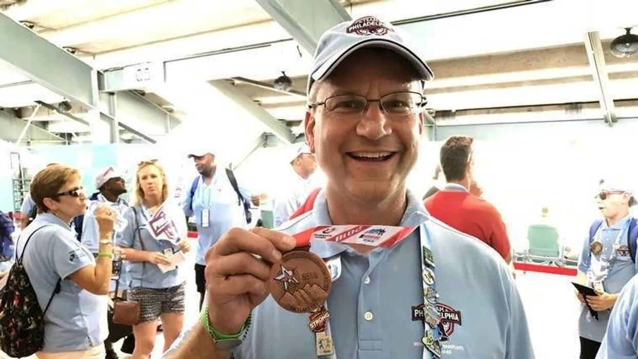 Bill Soloway holds up a medal at the 2018 Transplant Games of America in Salt Lake City.