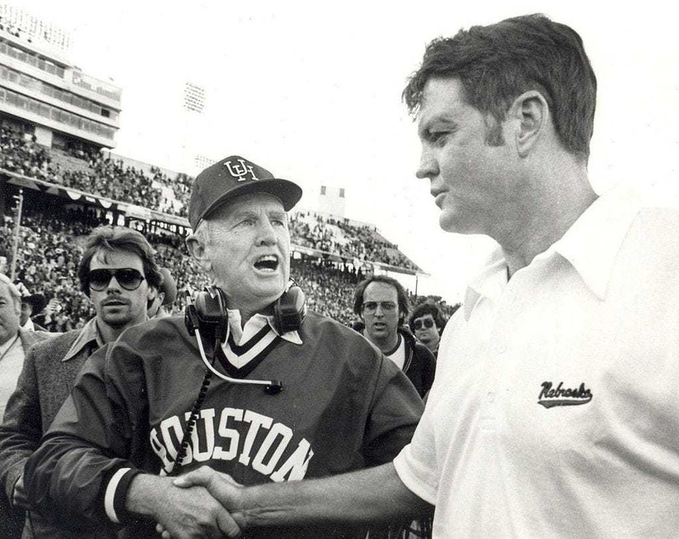 Bill Yeoman, head coach of the University of Houston Cougars football team and Bob Osborne head coach the Nebraska Cornhuskers shake hands after the 1980 Cotton Bowl on January 1, 1980 at the Cotton Bowl in Dallas, Texas. The Cougars won 17-14.
