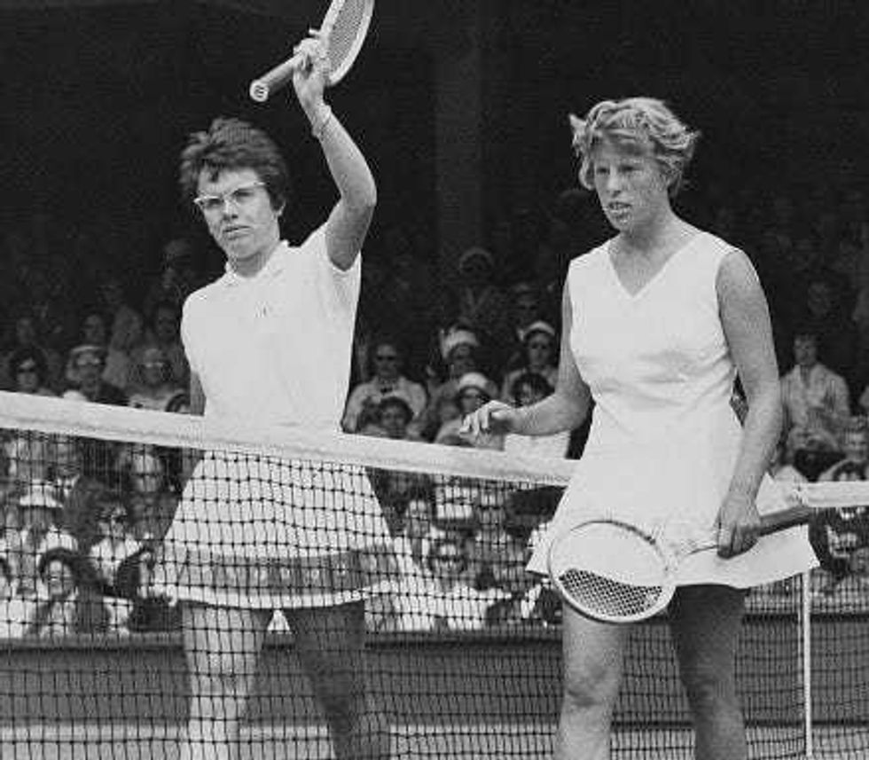Billie Jean Moffitt of the United States holds her tennis racquet aloft to acknowledge the crowd after losing to Ann Haydon of Great Britain in their Women