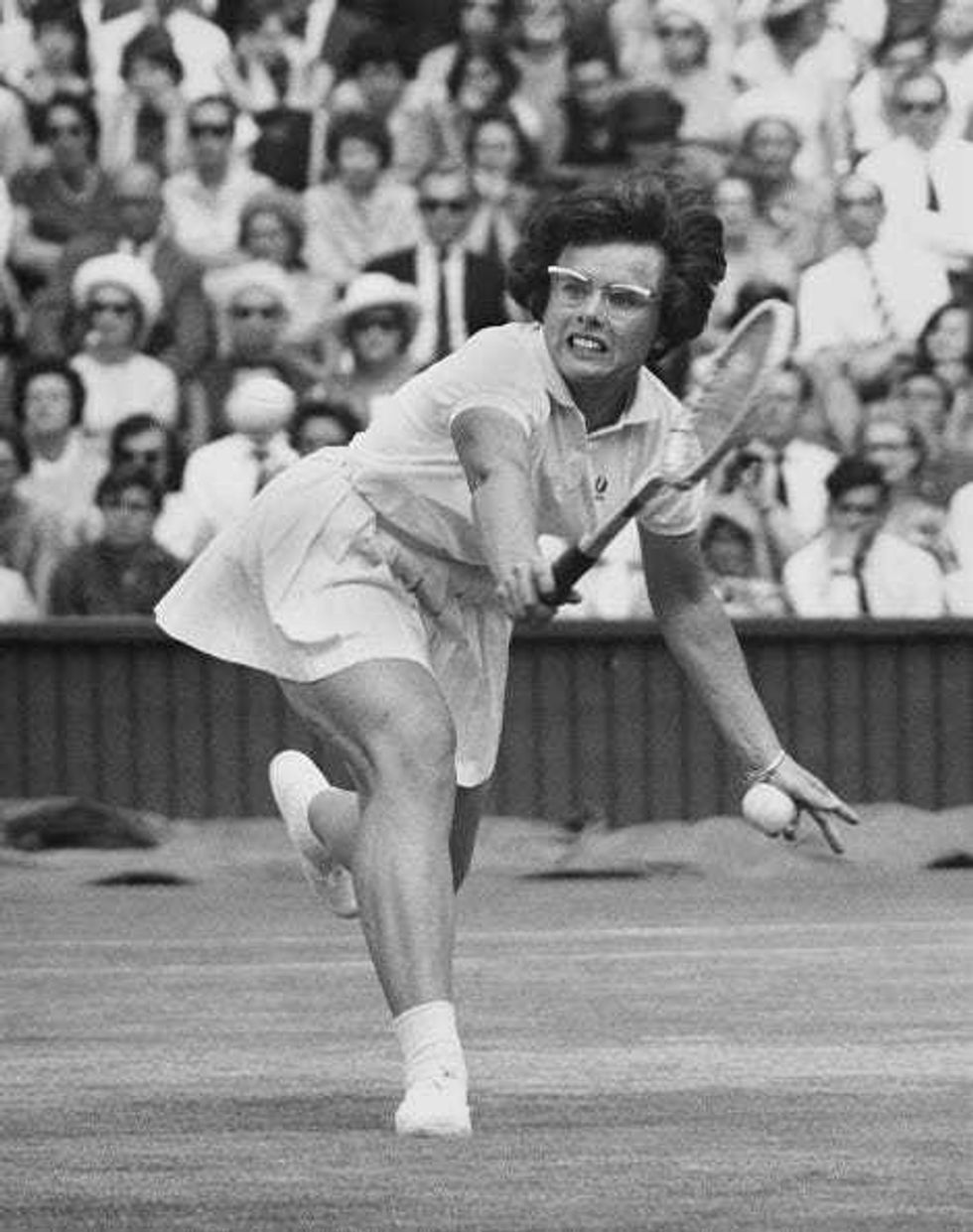 Billie Jean Moffitt of the United States looks at the tennis ball while playing a back hand return to Elizabeth Starkie of Great Britain during their Women