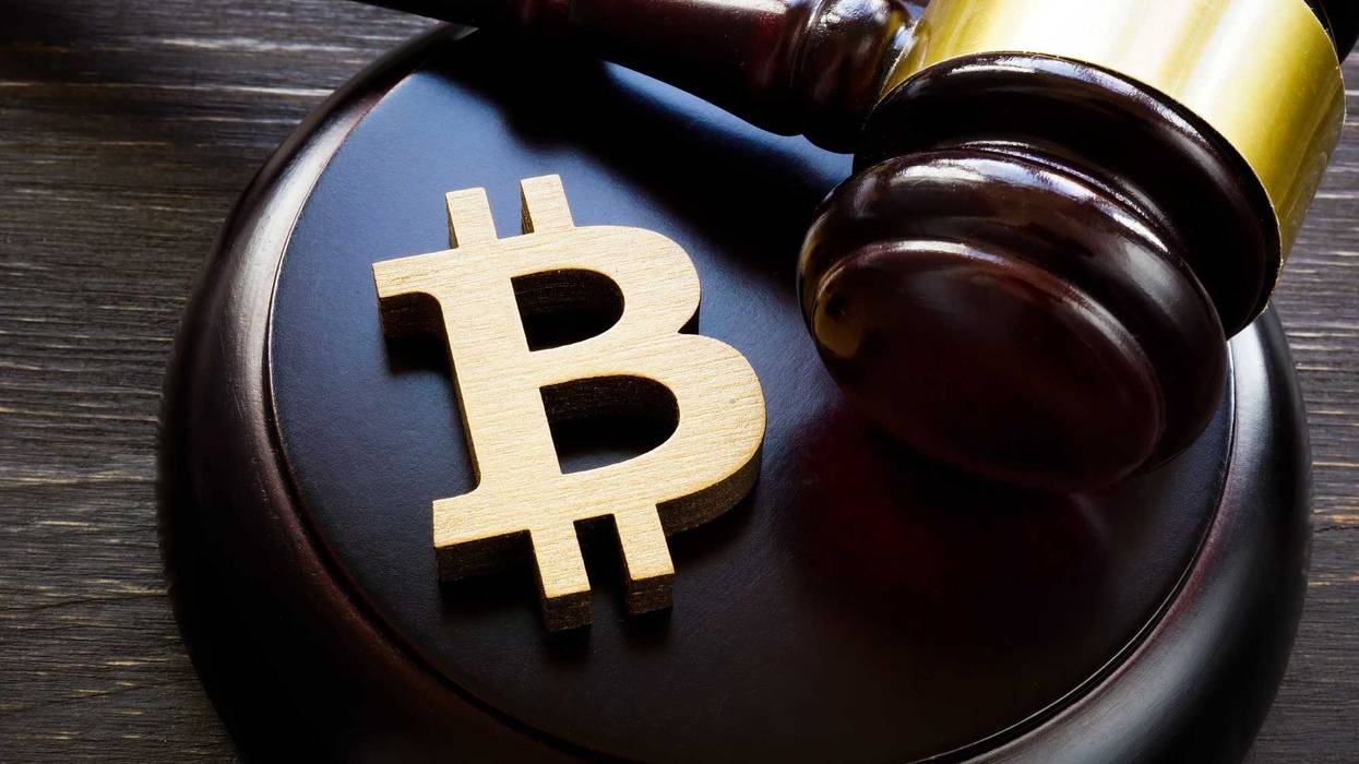 Bitcoin logo on a gavel.
