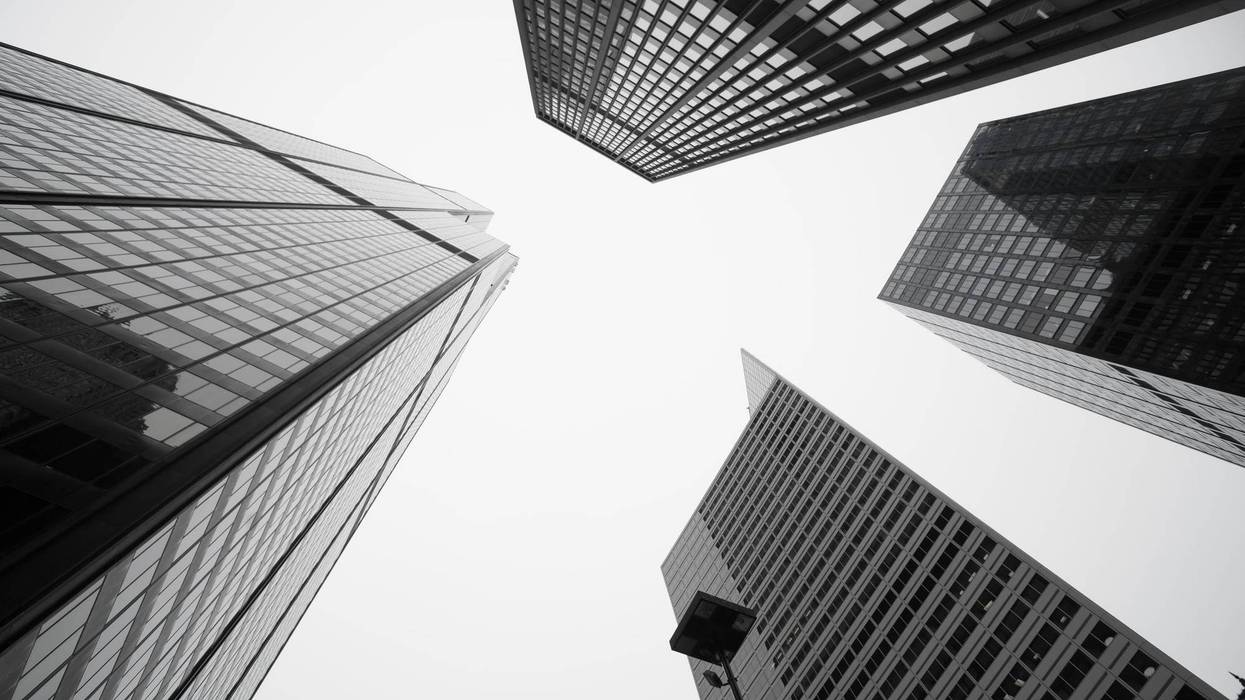 Black and white image towering Architecture and cityscapes of five Chicago buildings rising skyward Illinois USA