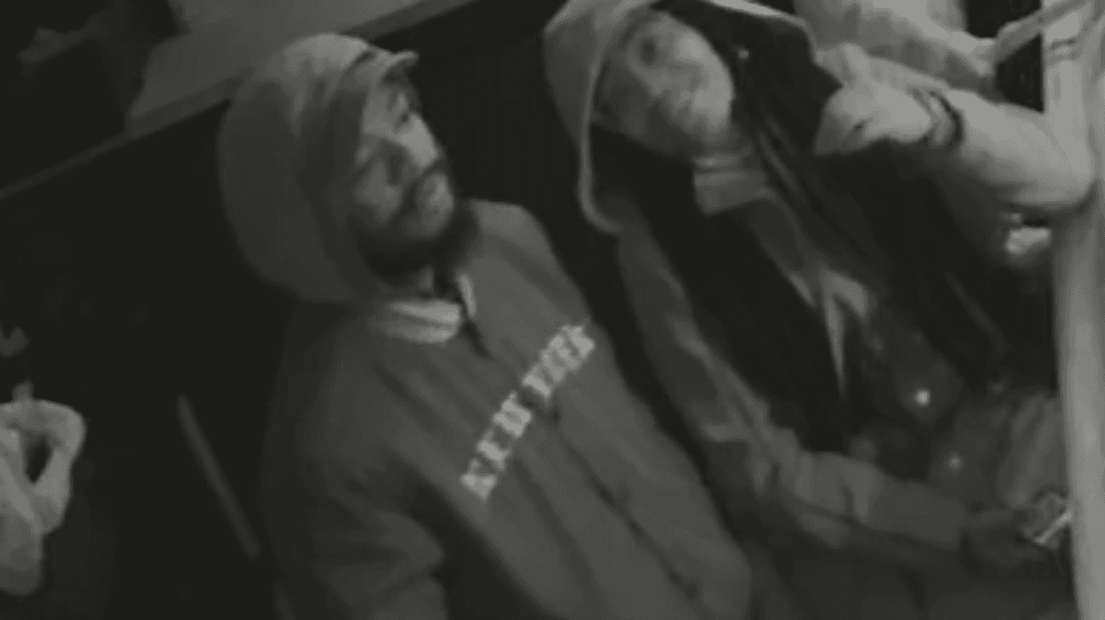 Black and white surveillance photo of Third Street Bar shooting person of interest
