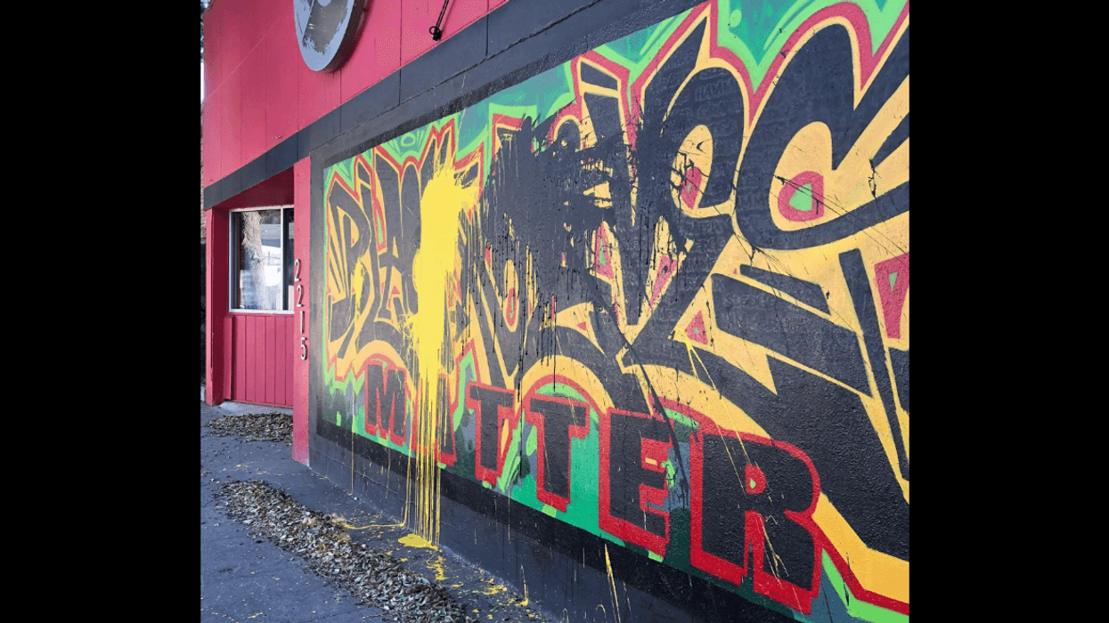 Black and yellow paint splattered on a Black Lives Matter mural in Sacramento.