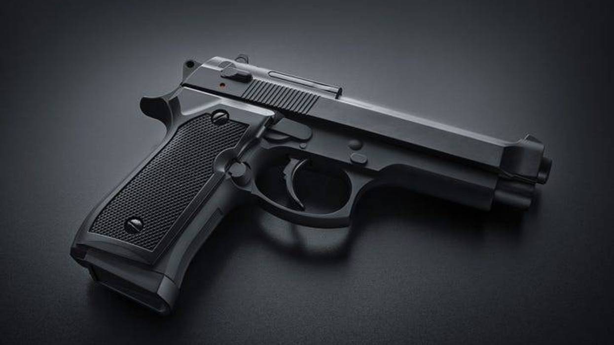 Black handgun on black background