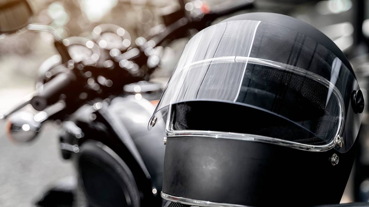 Black helmet on motorcycle seat