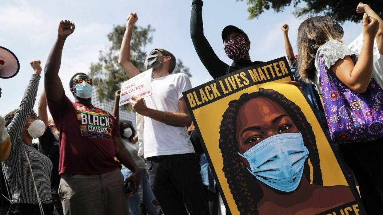 Black Lives Matter-Los Angeles supporters protest outside the Unified School District headquarters calling on the board of education to defund school police on June 23, 2020 in Los Angeles, California. The demonstrators want the funds currently spent on campus police to be reallocated to other student-serving priorities. (Photo by Mario Tama/Getty Images)