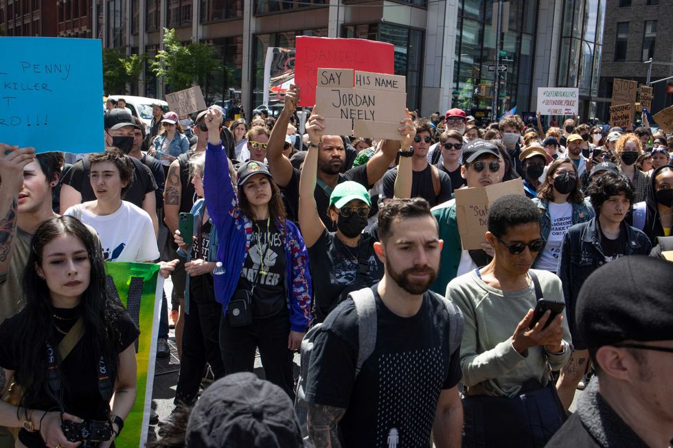 Black Lives Matter protestors march through the streets to demand justice for Jordan Neely on May 6, 2023