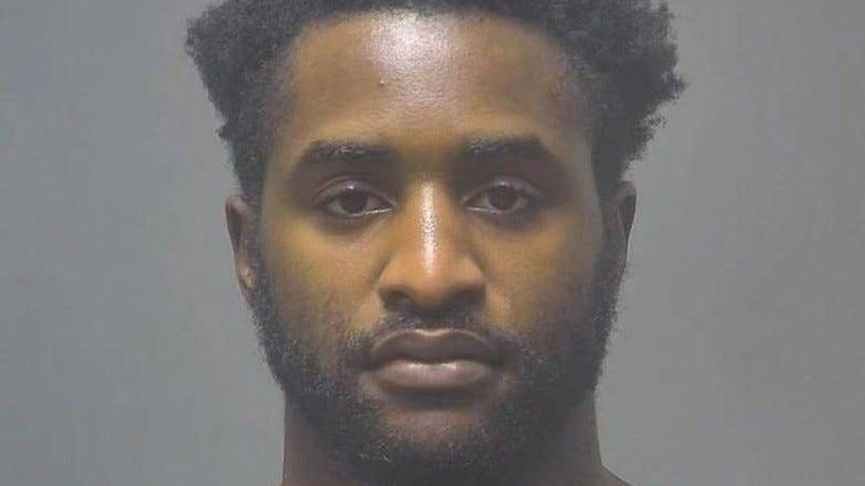 Black man in 20s not smiling with black hair and black beard