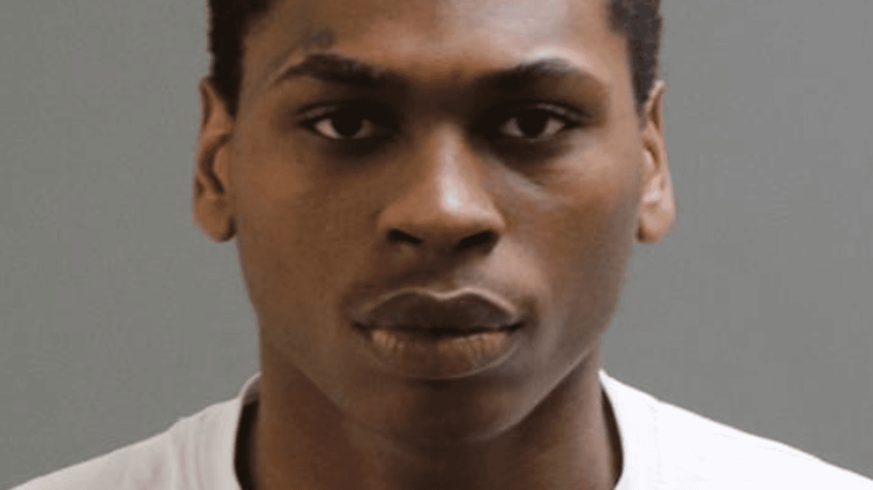 Black man in 20s wearing black hoodie