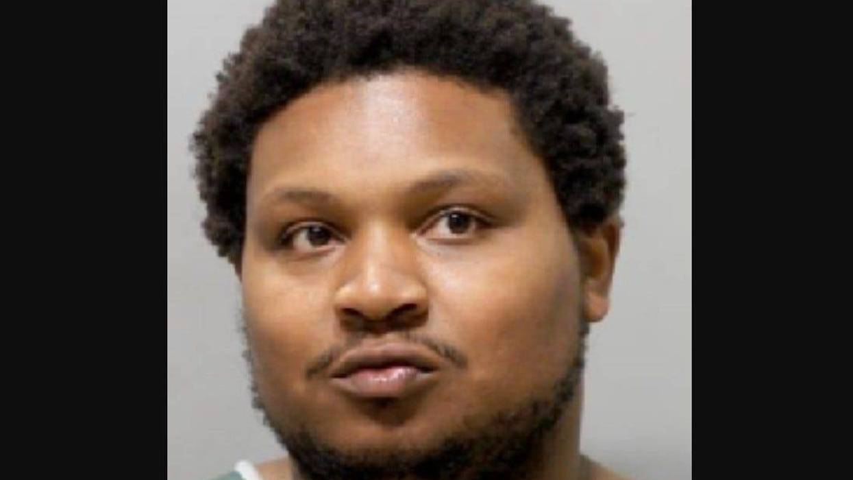 Black man in 30s with short afro and short black beard