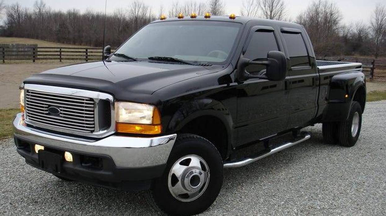 Black pickup truck with a silver grill and running lights above the windshield