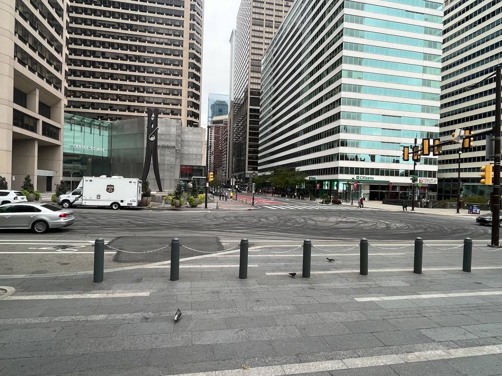 Black skid marks announce the location of an illegal car meet overnight at 15th and Market streets.