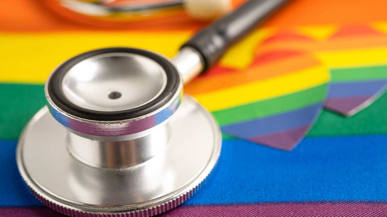 Black stethoscope on rainbow flag with heart, symbol of LGBT pride month celebrate annual in June social, symbol of gay, lesbian, bisexual, transgender, human rights and peace.