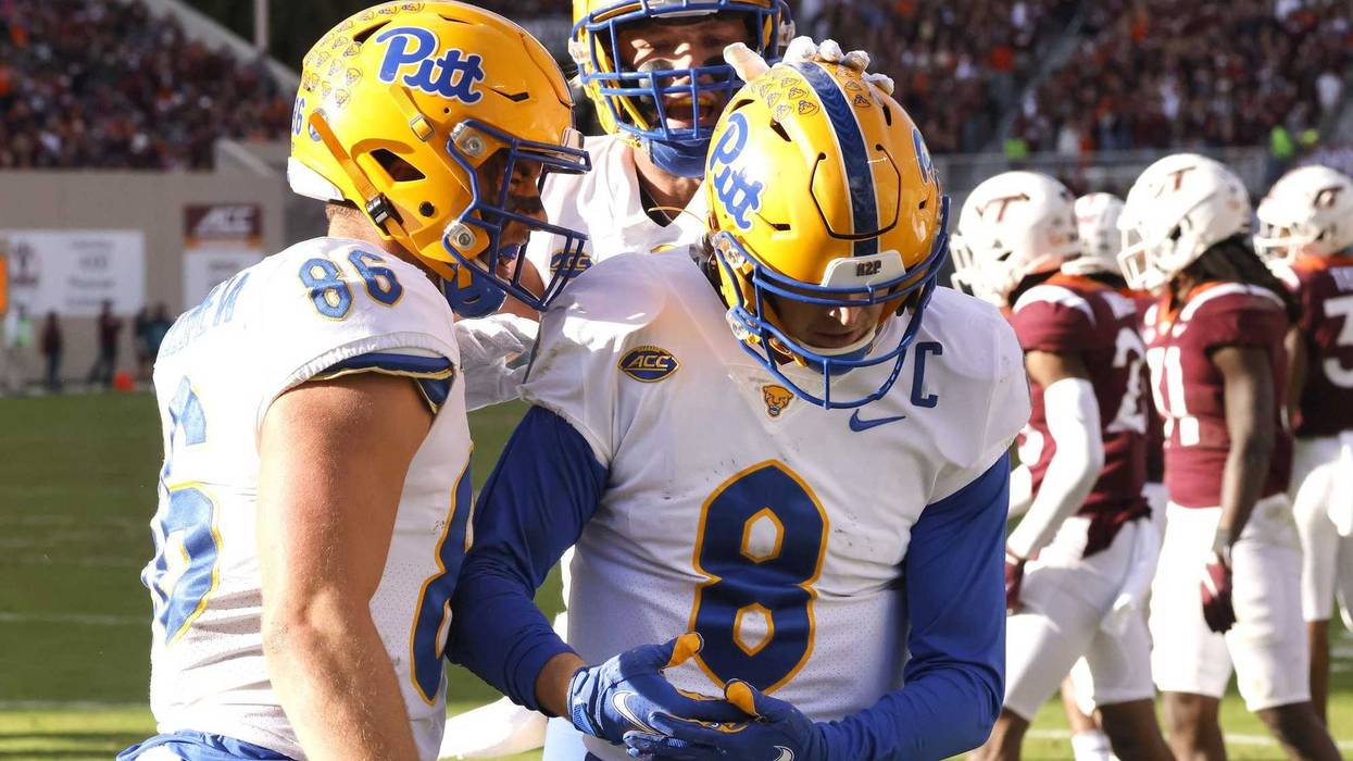 Blacksburg, Virginia, USA; Pittsburgh Panthers quarterback Kenny Pickett (8) celebrates a touchdown