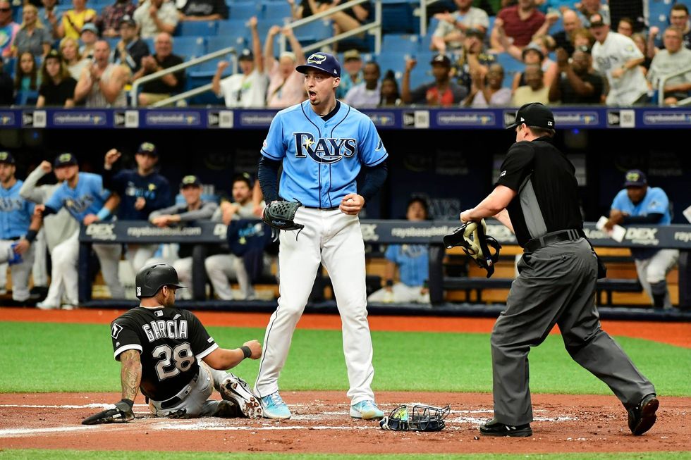 Blake Snell pumps his fist after making an out at home plate