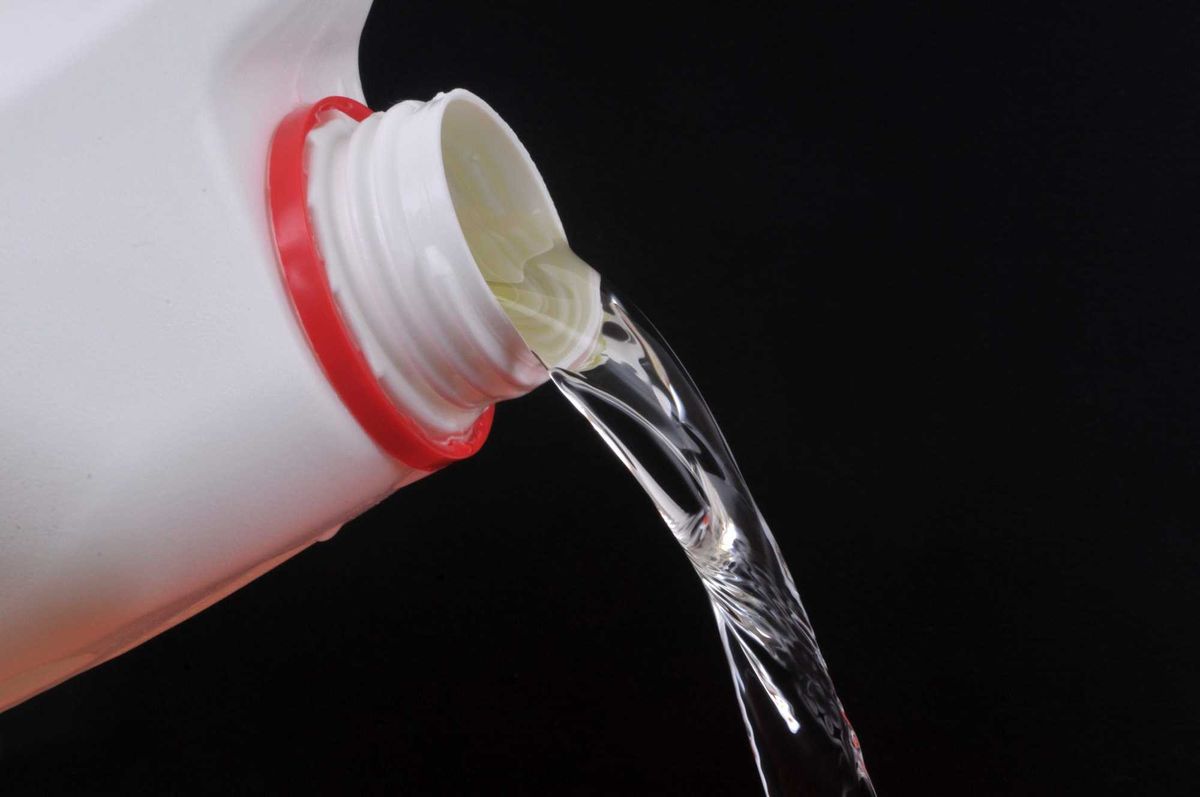 Bleach coming out of a bottle.