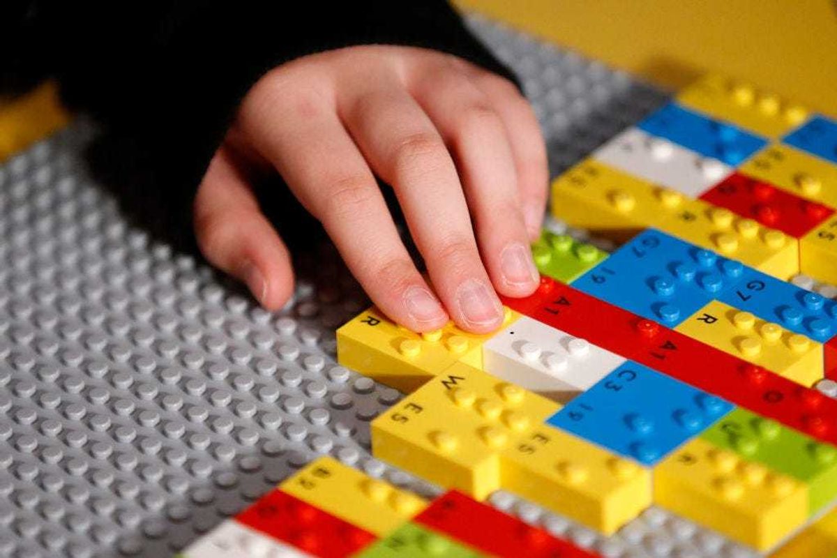 Blind and vision impaired children play with LEGO braille bricks for the first time at Legoland in Chadstone on April 15, 2021 in Melbourne, Australia.