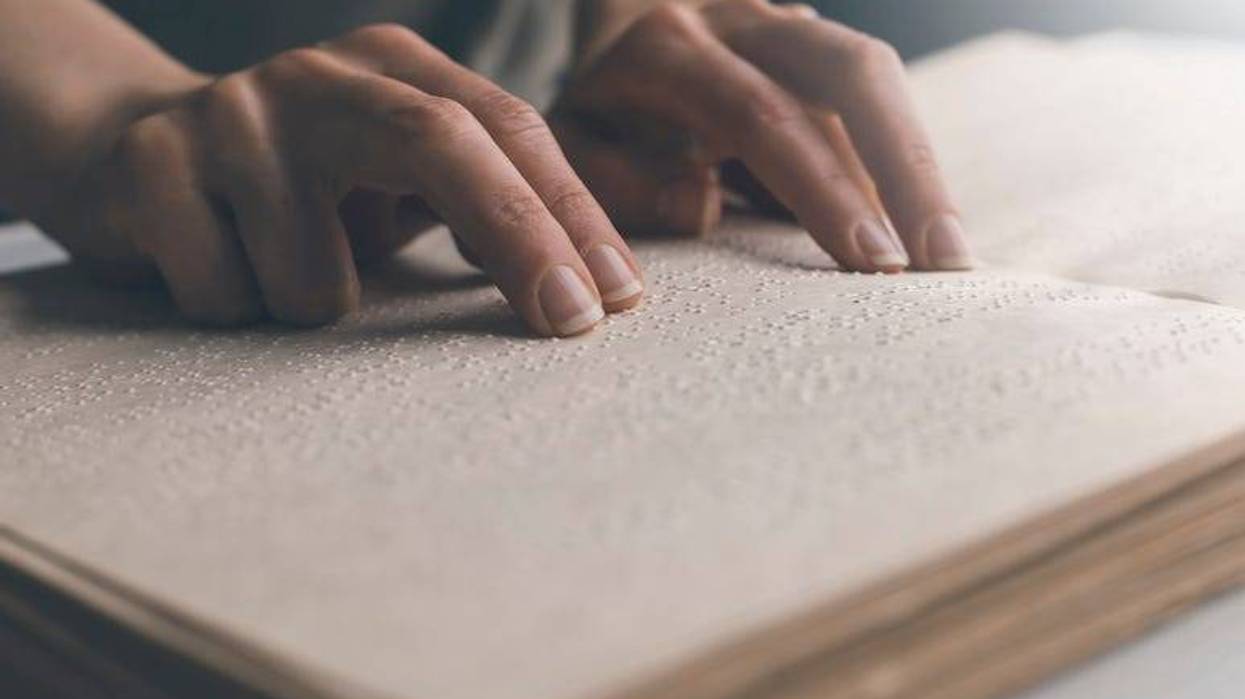 Blind person reading braille