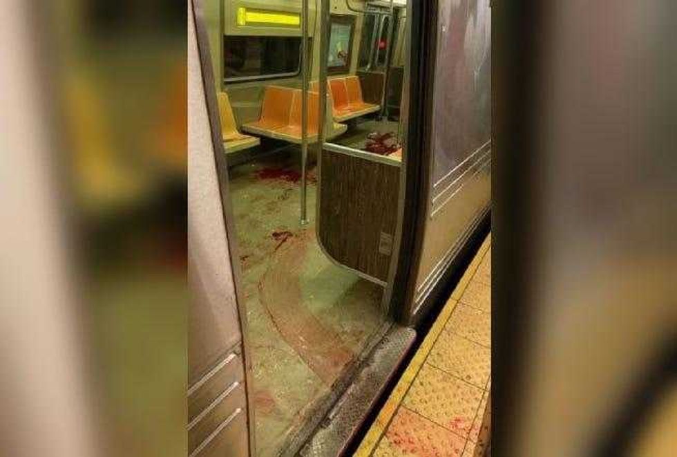 Blood is seen in an N train car at the 36th Street station in Sunset Park