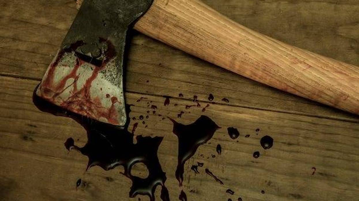 Bloody ax on wooden floor