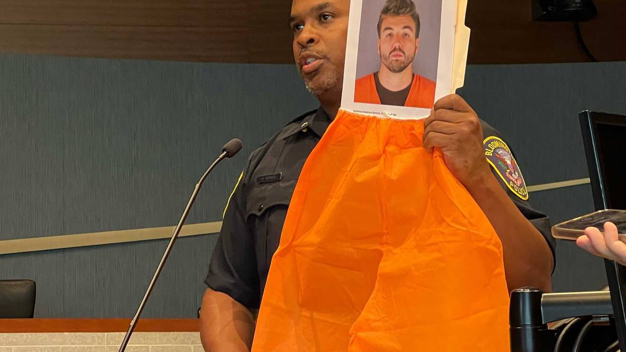 Bloomington Police Chief Booker Hodges holds up pictures of 28-year-old Matthew Anderson Bertsch, an 8th grade teacher in Richfield who was charged with Criminal Sexual Conduct 2nd Degree, among other charges.