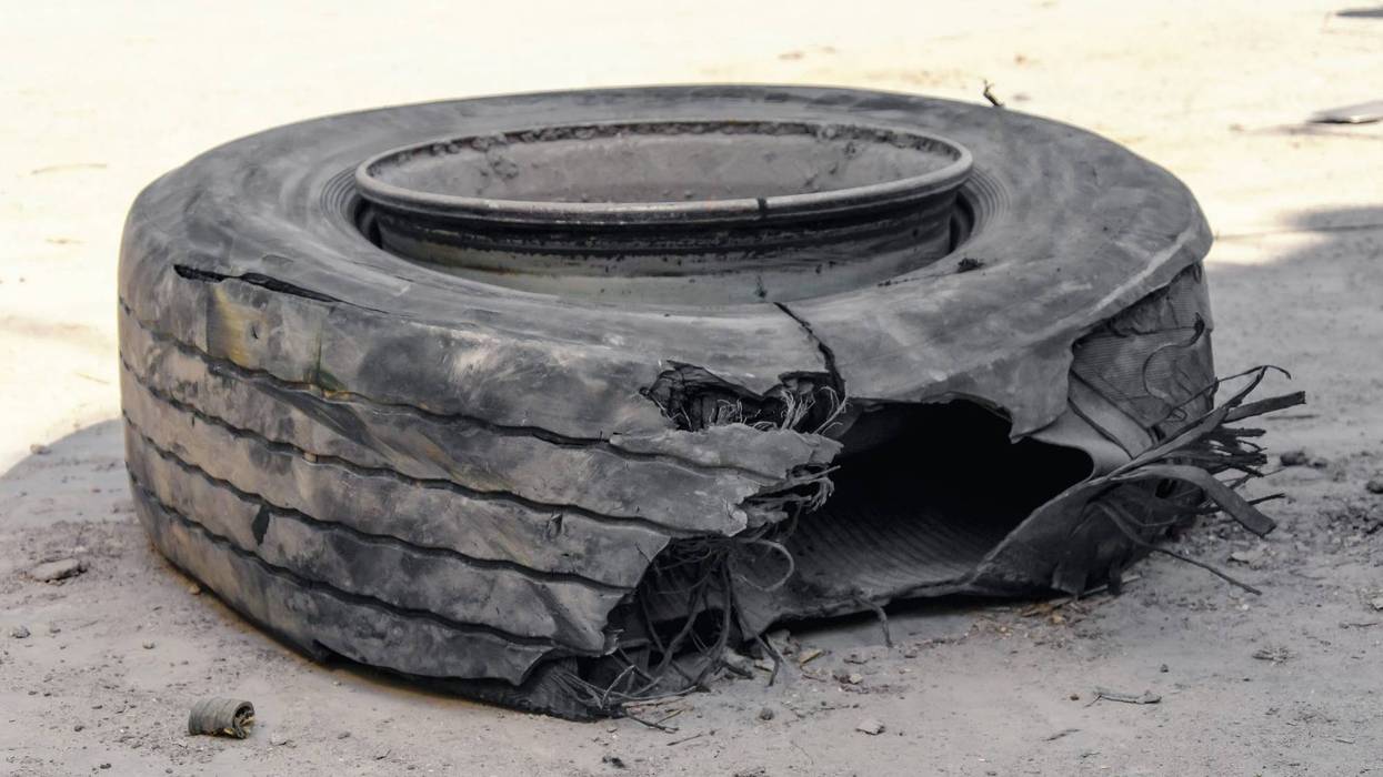 Blown out tire on side of highway