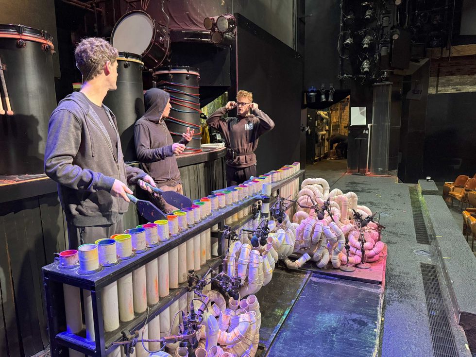 Blue Man Group performers conducting sound check
