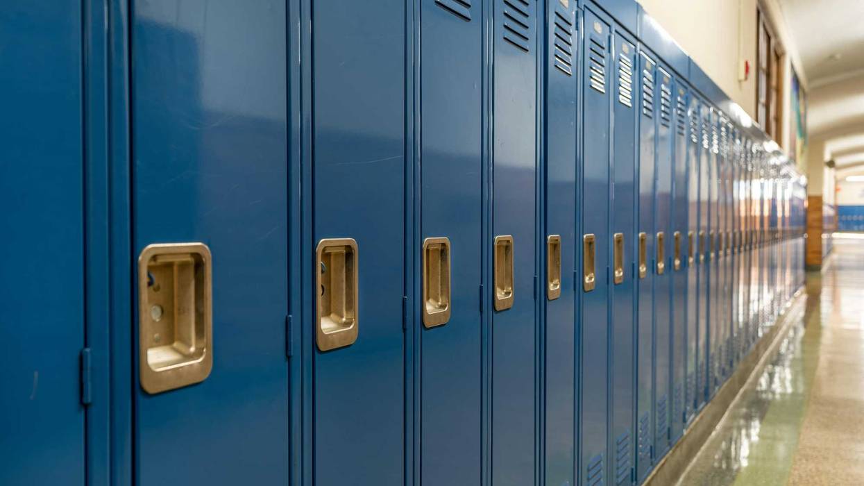 Blue metal lockers along a nondescript hallway