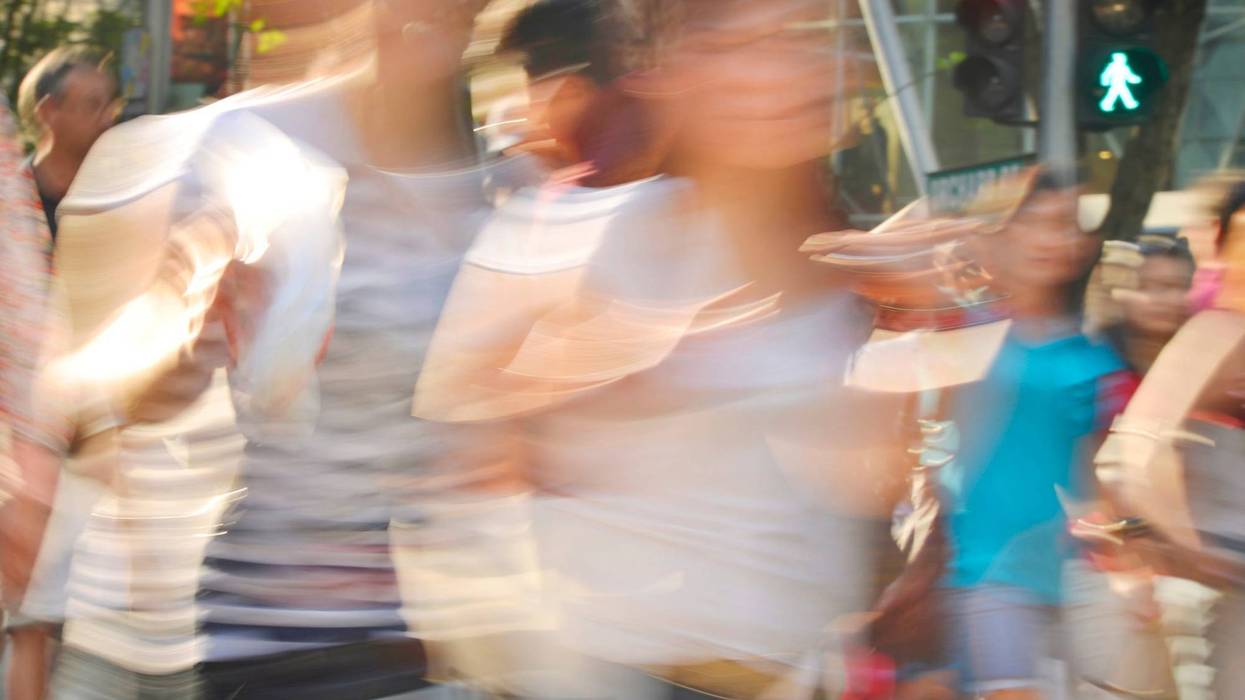 blurred images of people on street