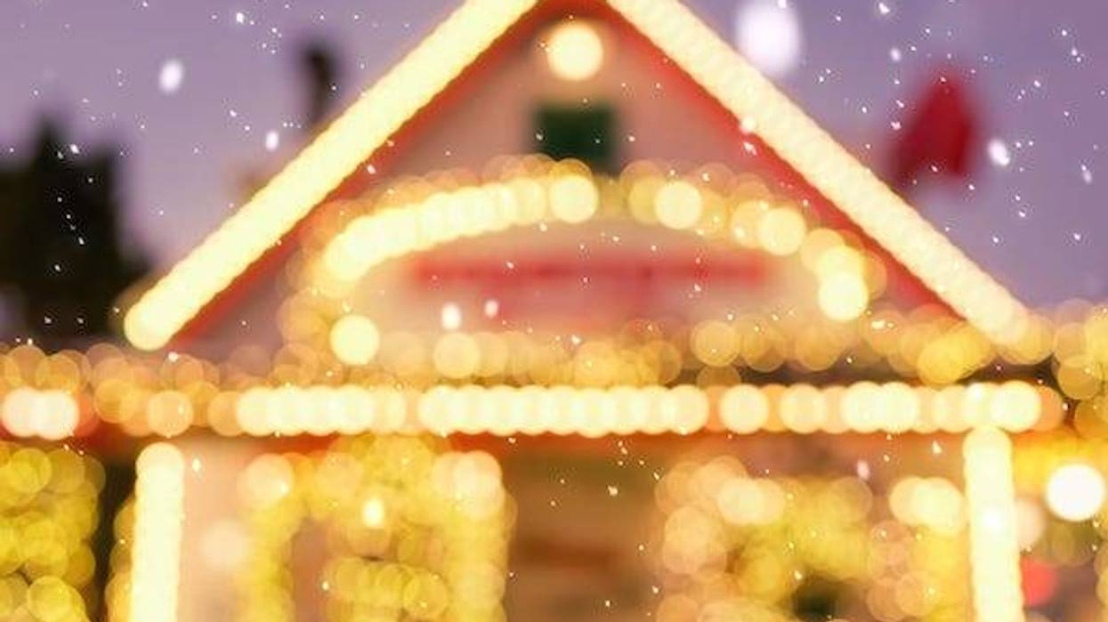 Blurry image of a house decorated with Christmas lights