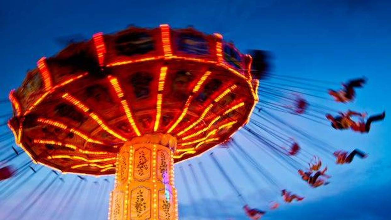 Blurry image of a swing ride at an amusement park