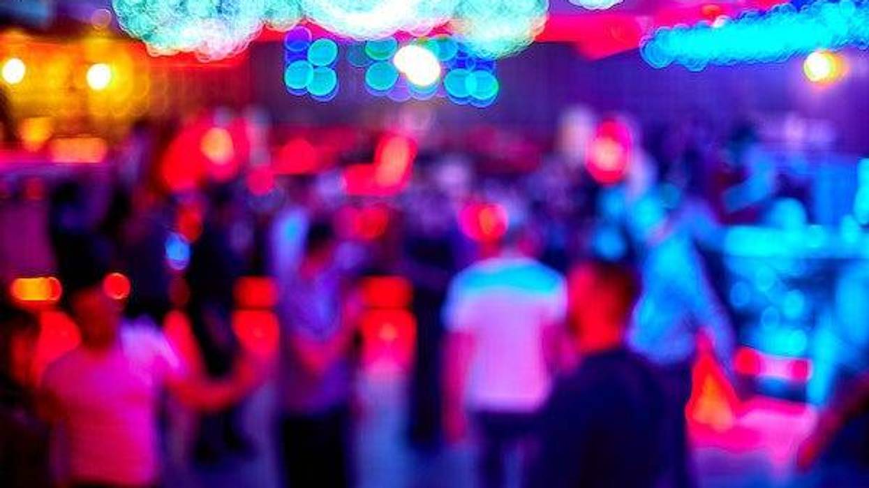 Blurry photo of people dancing in a nightclub