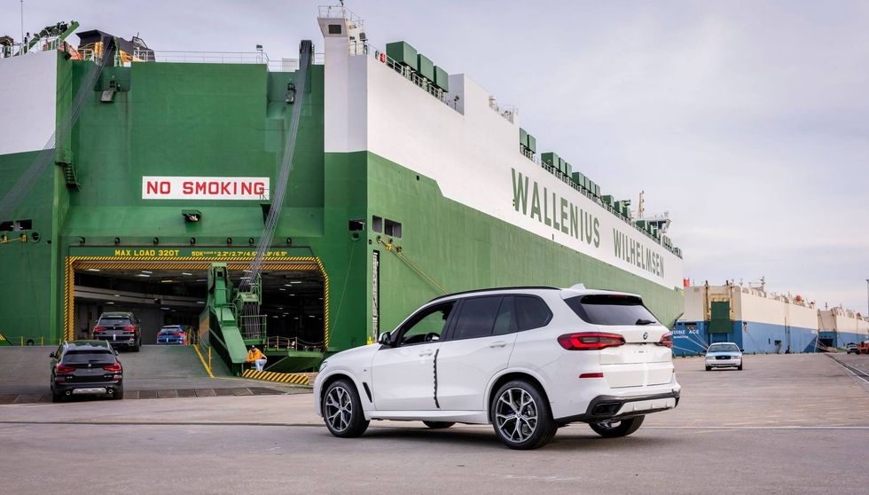 BMW X vehicles drive onto a Roll-on Roll-off shipping vessel at the Port of Charleston in South Carolina.