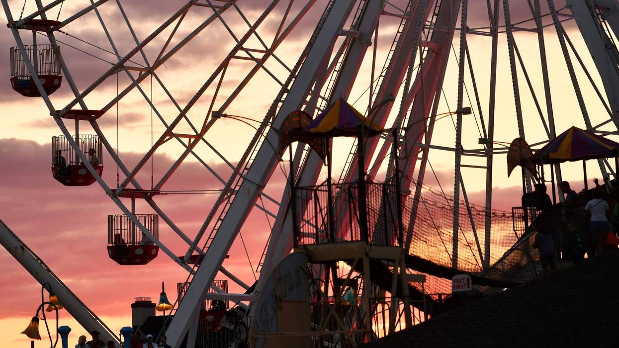 Boardwalk visitors ride the Ferris wheel at Gillian's Wonderland Pier in Ocean City.