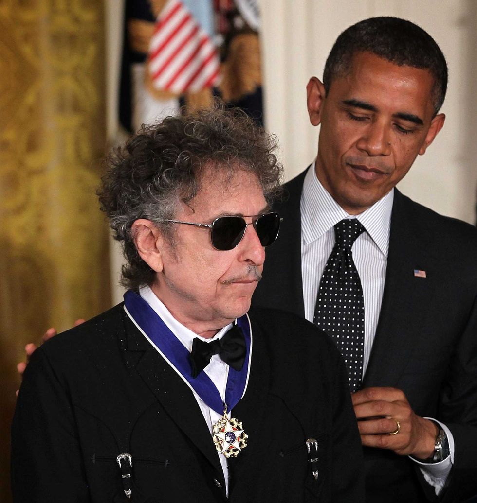 Bob Dylan (L) is presented with a Presidential Medal of Freedom by U.S. President Barack Obama (R) during an East Room event May 29, 2012 at the White House in Washington, DC.