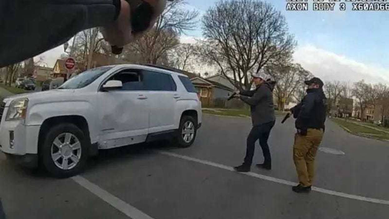 Body camera footage shows Chicago police officers surrounding Dexter Reed Jr.'s vehicle during what police have described as a traffic stop.