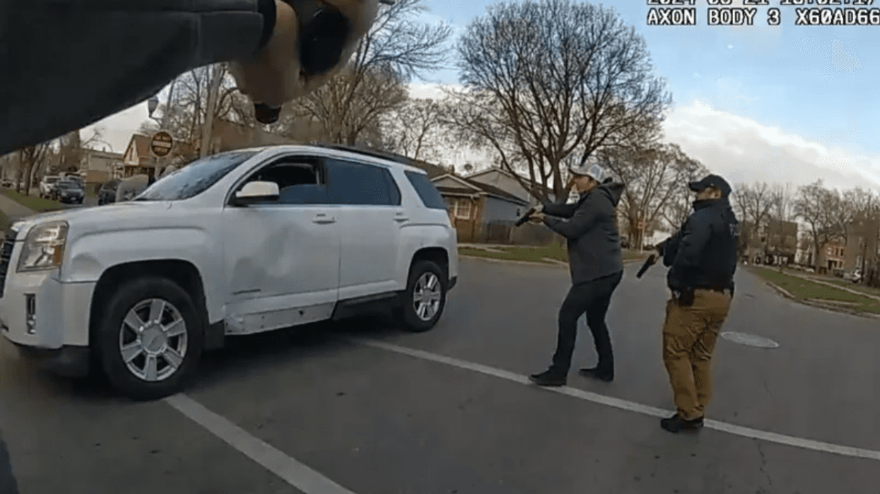 Body camera footage shows Chicago police officers surrounding Dexter Reed Jr.'s vehicle during what police have described as a traffic stop.