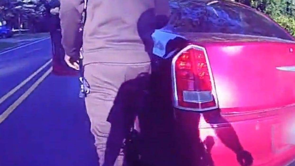 Body camera footage shows uncooperative suspect walking back to car before dragging Michigan State Police trooper