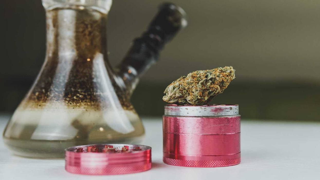 Bong and weed grinder stock photo.