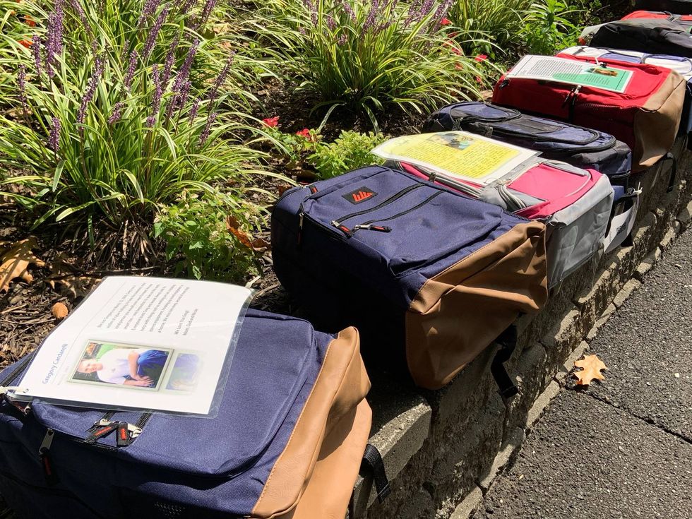 Book bags displayed at Penn State Abington to build awareness about suicide and mental health among students.