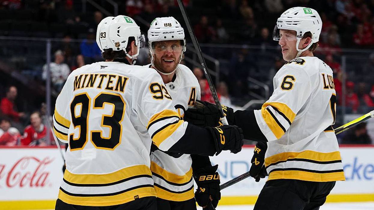 Boston Bruins Fraser Minten, David Pastrnak and Mason Lohrei celebrate a goal